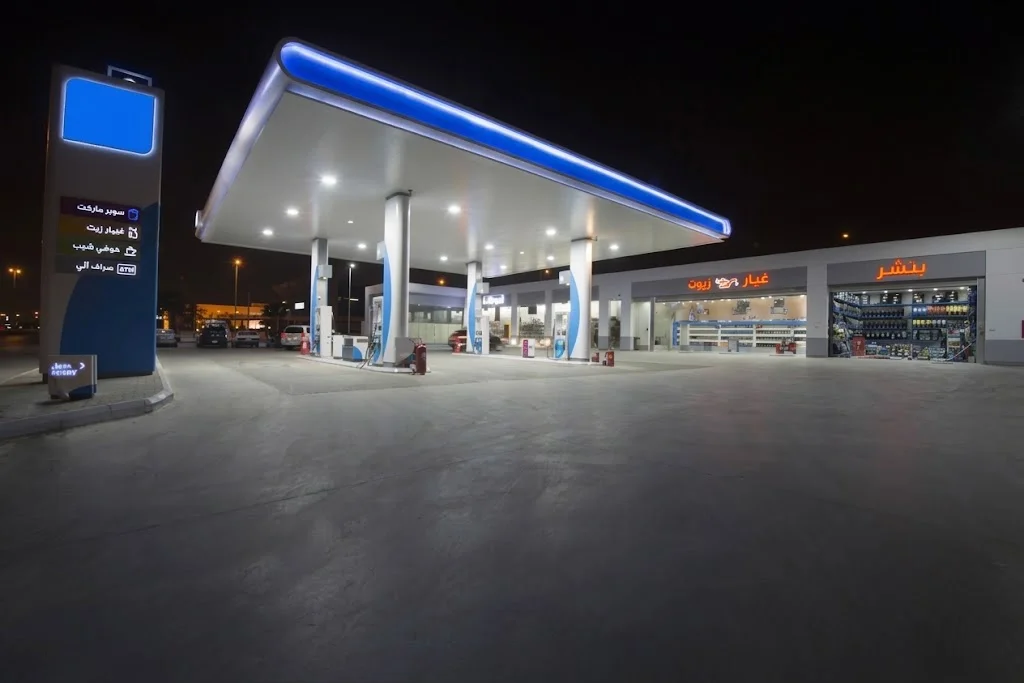 A Saudi fuel station at night.