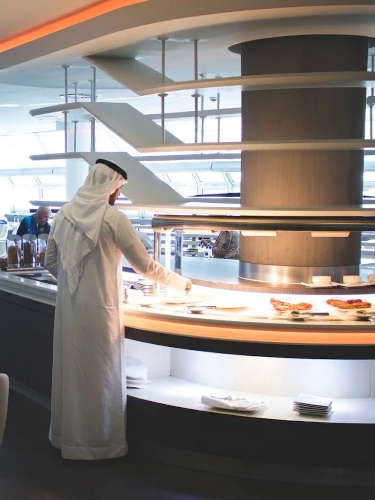 A business traveler at an airport lounge buffet